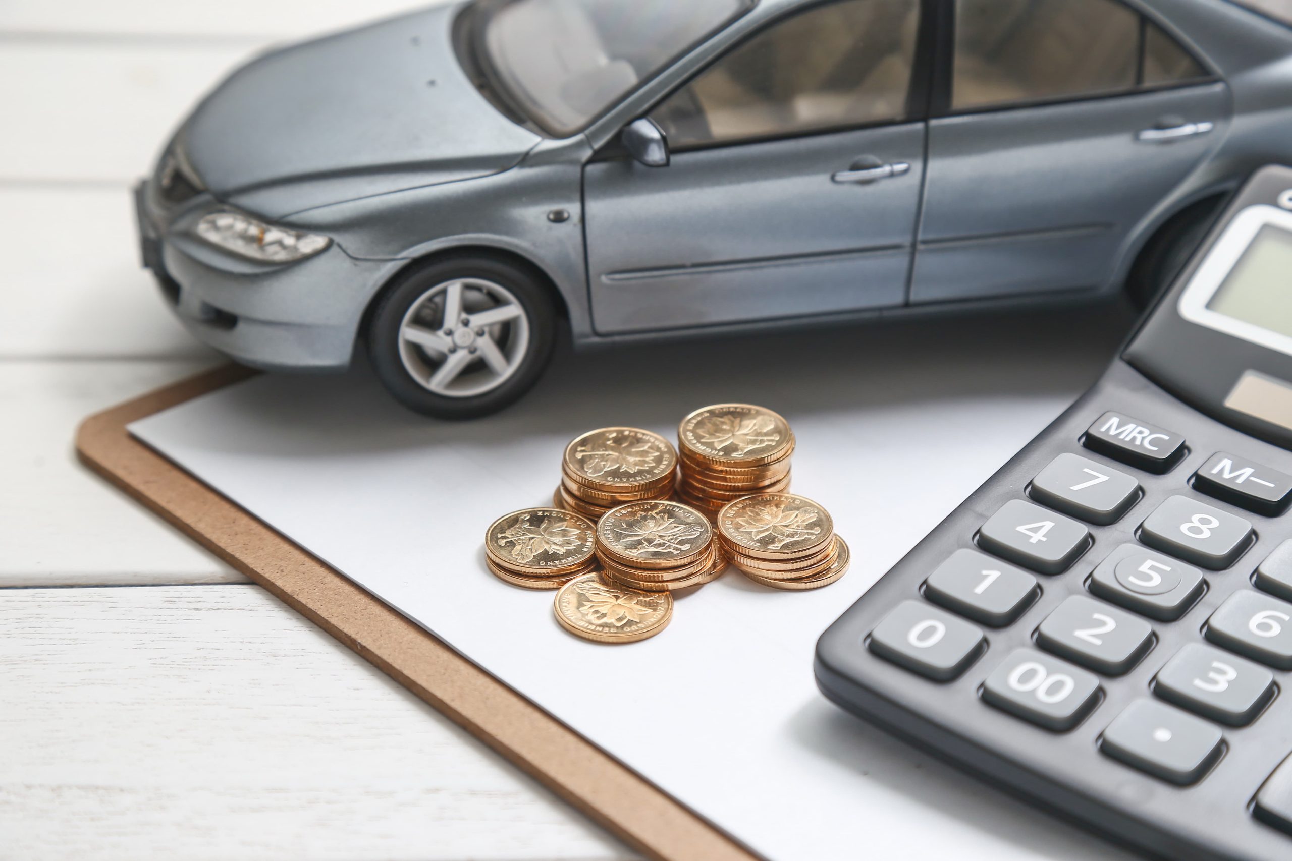 car-model-calculator-coins-white-table (1)